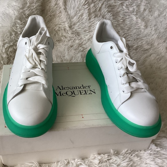 Alexander McQueen leather low top sneakers with aqua green bottoms